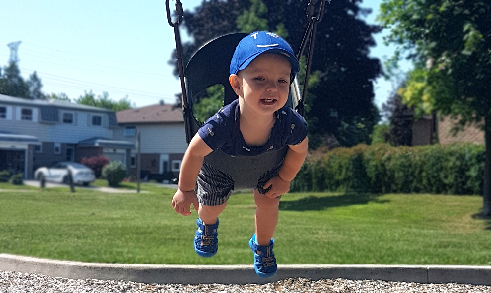 Happy baby on the swing